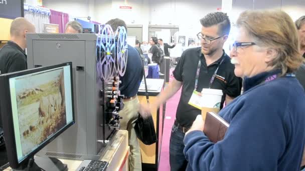 Operator demonstrates the film restoration during NAB Show 2014 in Las Vegas, USA. — Stock Video