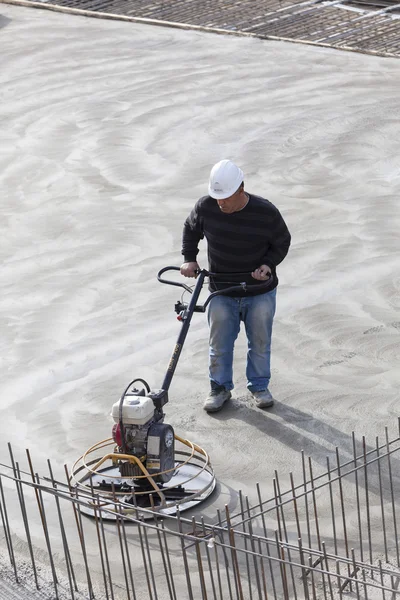 Workers at the construction site of the foundation of the buildi — Stock Photo, Image