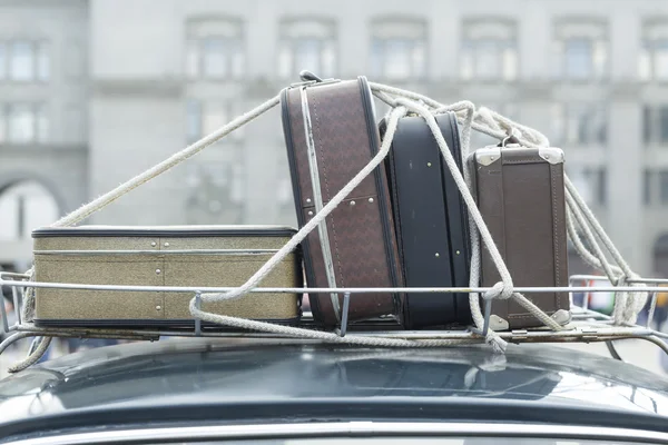 Vintage suitcases on the roof car. Stock Picture