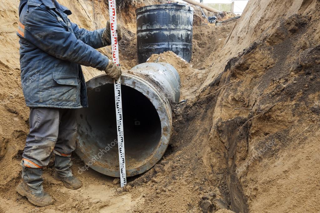 Sewer pipe in the trench — Stock Photo © Omstudio 118892410