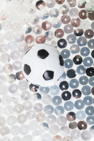 Soccer ball on glitter background