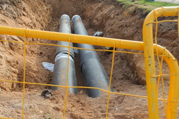 Pipes for water in trench — Stock Photo, Image