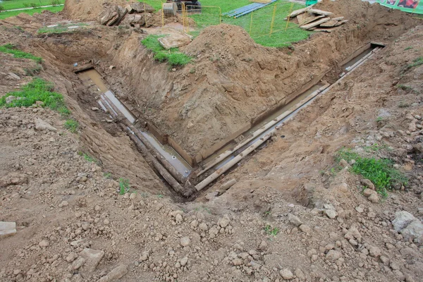 Pipes for water in trench — Stock Photo, Image