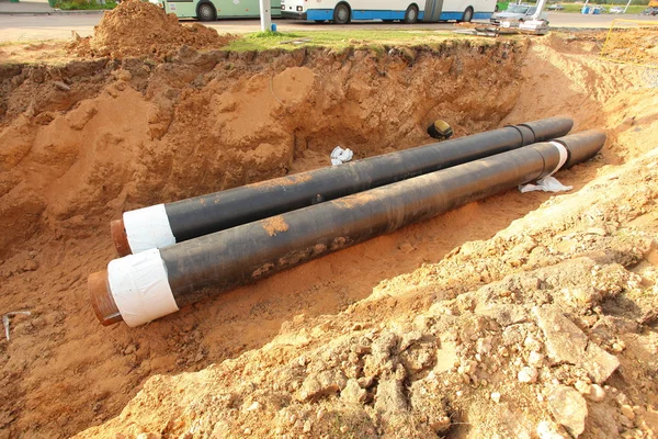 Pipes for water in a trench — Stock Photo, Image