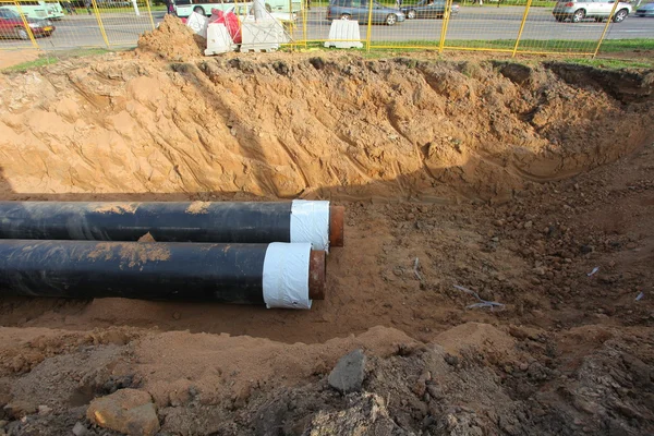 Pipes for water in a trench — Stock Photo, Image