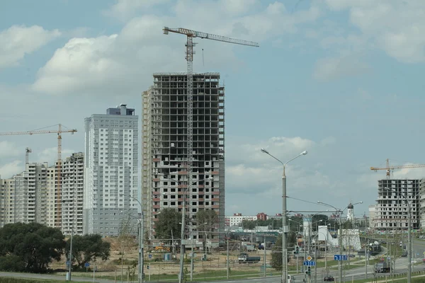 Complex construction. Cranes on buildings — Stock Photo, Image