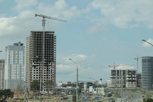Complex construction. Cranes on buildings — Stock Photo, Image