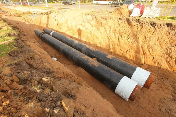 Pipes for water in a trench — Stock Photo, Image