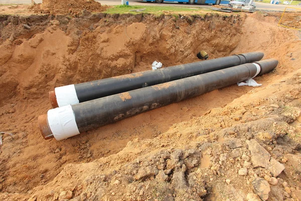 Pipes for water in trench — Stock Photo, Image