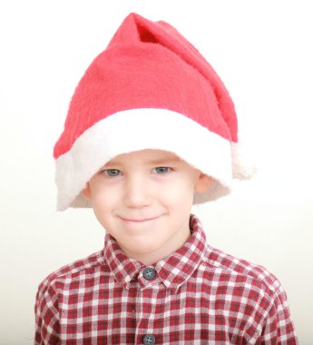 Little boy wearing santa hat