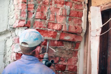 Adam holding perforator