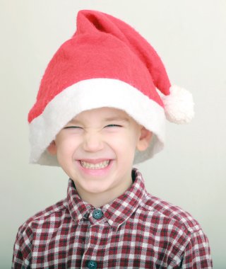 Little boy wearing santa hat
