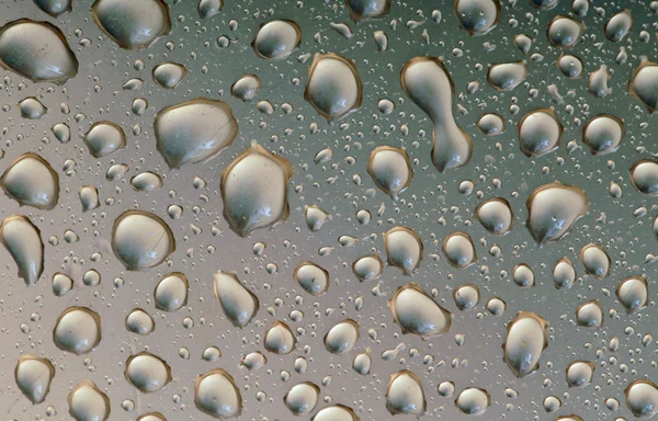 Drops of water on dark surface — Stock Photo, Image