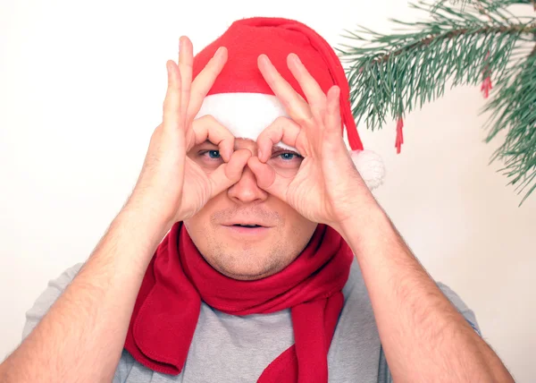 Santa looking through binoculars — Stock Photo, Image