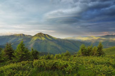 Morning in the mountains with a stormy sky
