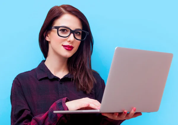 Portrait of a young woman with laptop — Stock Photo, Image