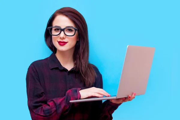 Portrait of a young woman with laptop — Stock Photo, Image
