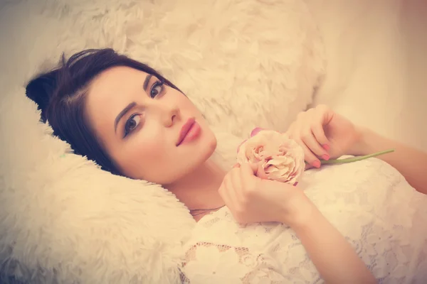 Portrait of a young woman with flower — Stock Photo, Image