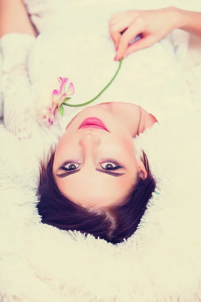 Portrait of a young woman with flower — Stock Photo, Image