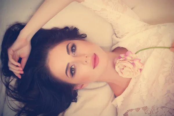 Portrait of a young woman with flower — Stock Photo, Image