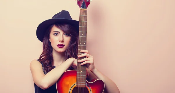Portrait of a young beautiful woman with guitar — Stock Photo, Image