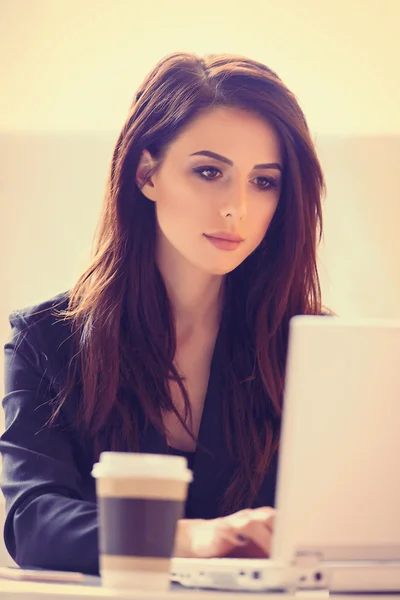 Portrait of young woman with cup of coffee — Stock Photo, Image