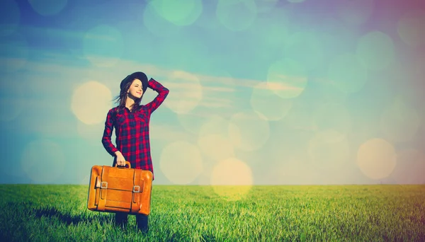 Portrait of young woman with suitcase — Stock Photo, Image