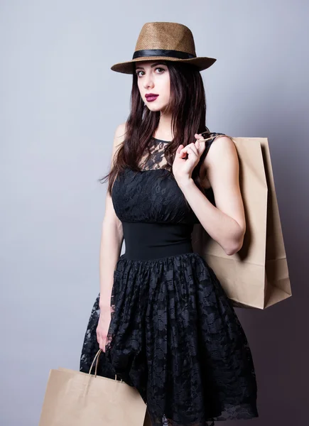 Portrait of young woman with shopping bags — Stock Photo, Image