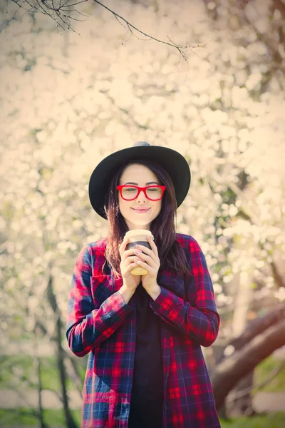 Portrait of young woman with cup of coffee — Stock Photo, Image