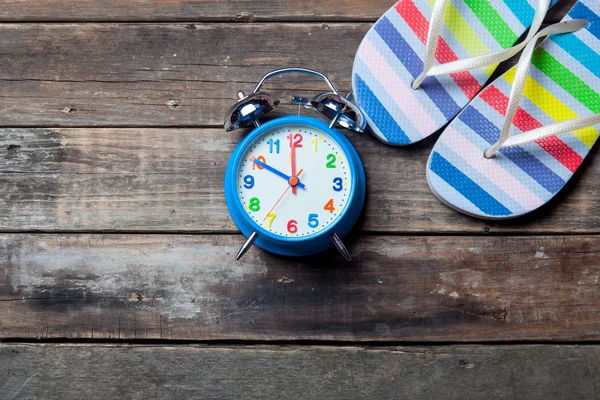 Clock and sandals — Stock Photo, Image