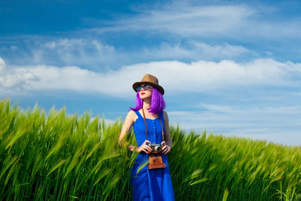 Young woman with camera — Stock Photo, Image