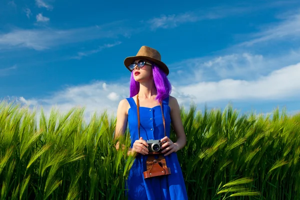 Young woman with camera — Stock Photo, Image