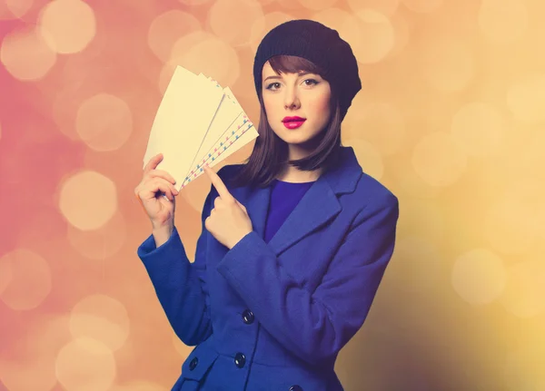 Woman in blue dress with envelopes — Stock Photo, Image