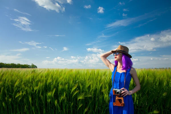 Young woman with camera Royalty Free Stock Photos