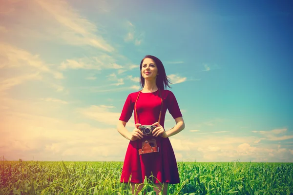 Young woman with camera Stock Photo