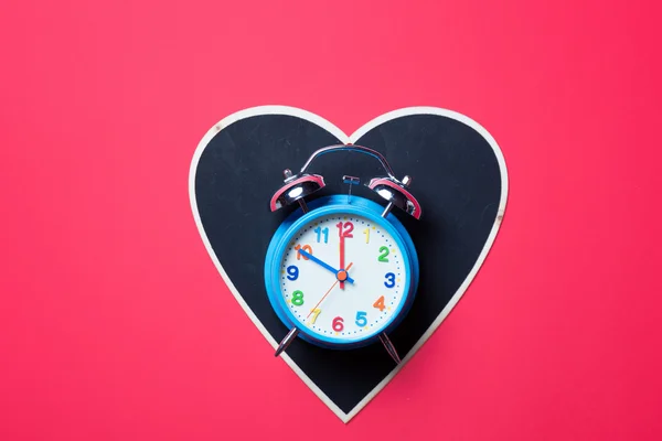 Black board and blue clock — Stock Photo, Image