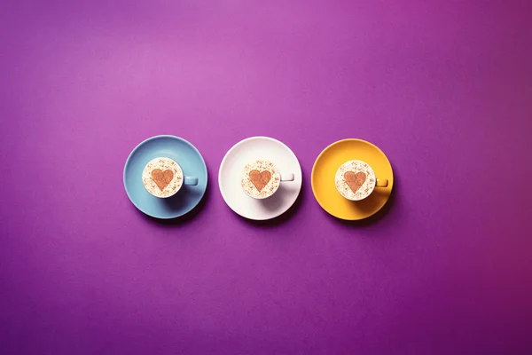 Cups on the purple background — Stock Photo, Image