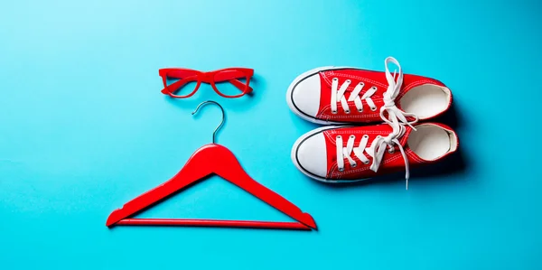 Glasses, hanger and gumshoes — Stock Photo, Image