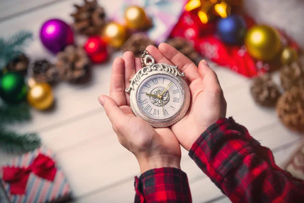 Child hands holding a clock — Stock Photo, Image