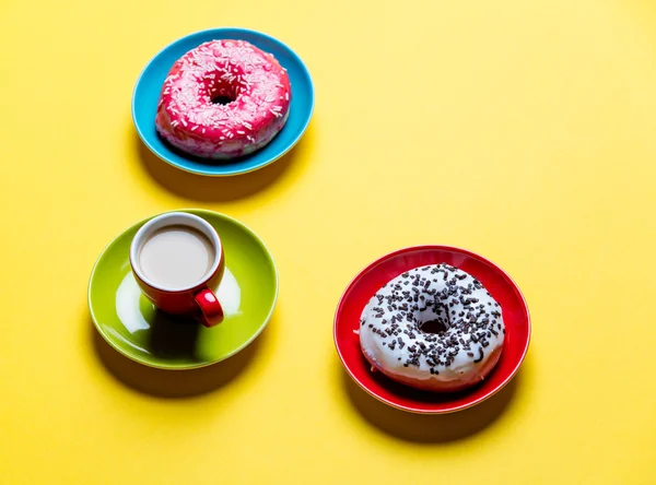 Donuts and cup of coffee — Stock Photo, Image