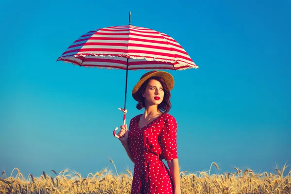 Young woman with umbrella — Stock Photo, Image