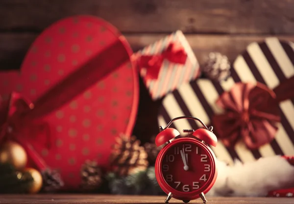 Alarm clock on the christmas decorations — Stock Photo, Image