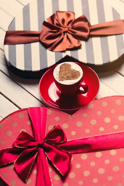 Cup of coffee and gifts — Stock Photo, Image