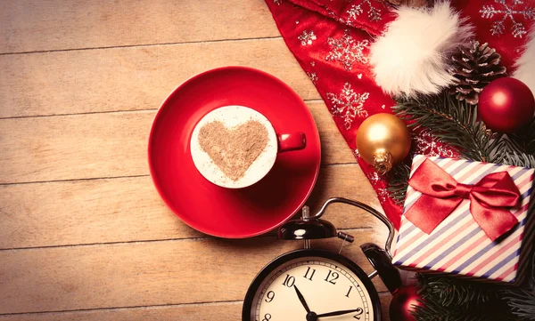 Cup of coffee, clock and christmas decorations — Stock Photo, Image