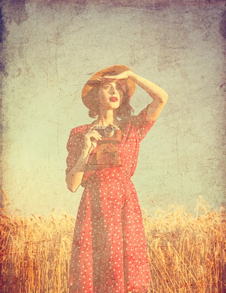 Young woman with suitcase and camera — Stock Photo, Image