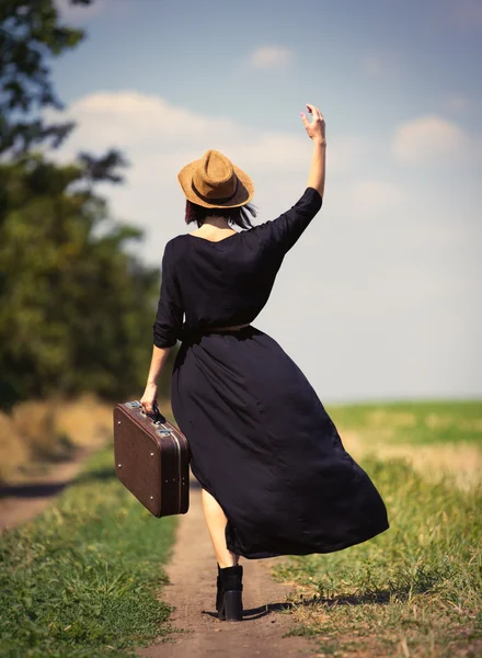 Young woman with suitcase — Stock Photo, Image