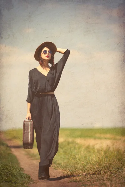 Young woman with suitcase — Stock Photo, Image