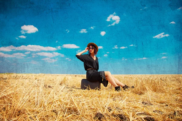 Young woman with suitcase Stock Photo