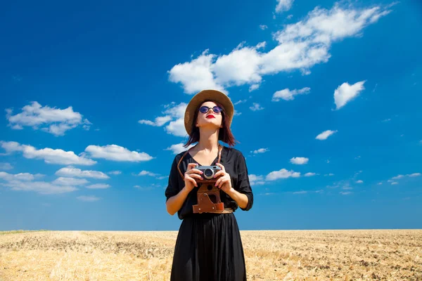 Young woman with camera Royalty Free Stock Photos