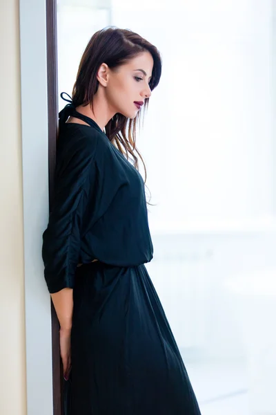 Young woman in the doorway — Stock Photo, Image